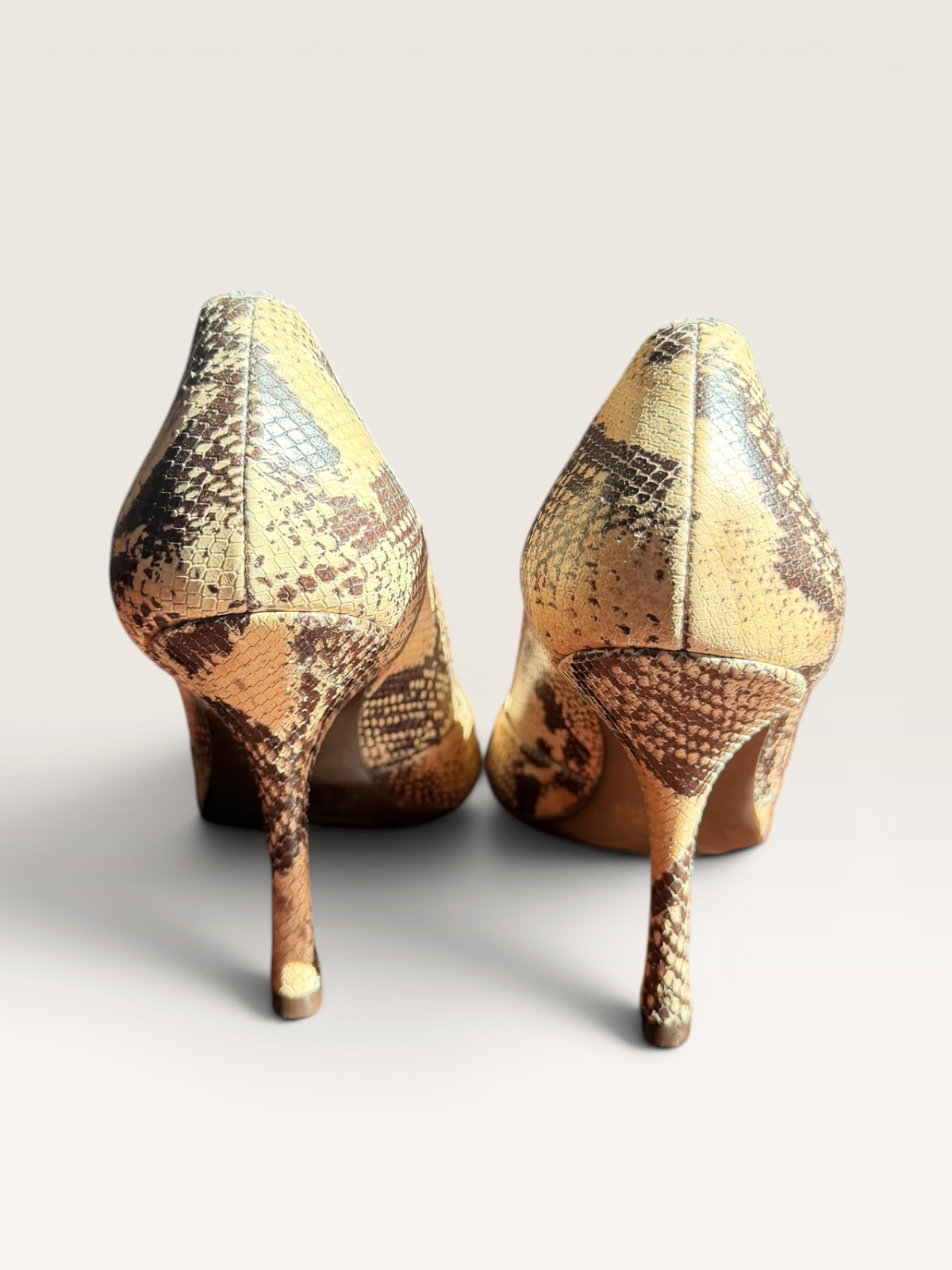 BCBGeneratoon Snakeskin Pumps